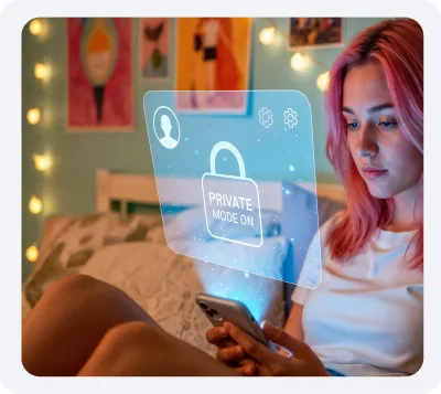 A young woman with pink hair sits on a bed using a smartphone, displaying a hologram that says "Private Mode On."